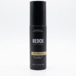 Redox holding spray for hair building fibers